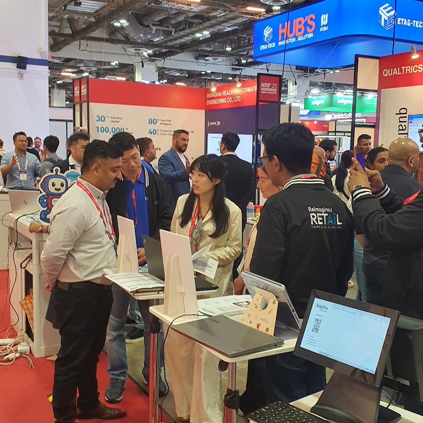 Visitors at the FootfallCam booth during NRF 2025